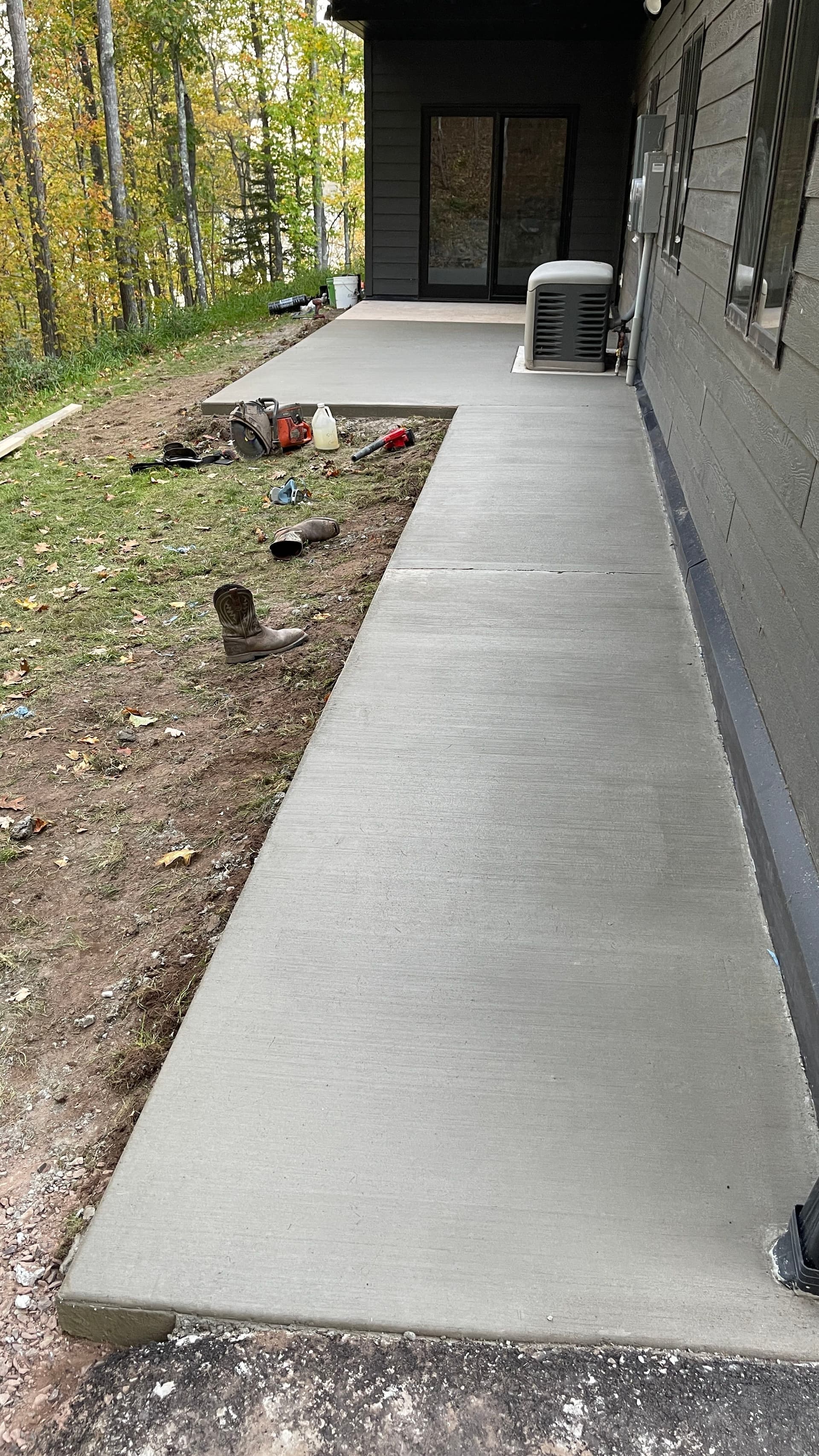 Concrete Patio and Sidewalk Pour Gives Homeowner a Clean Path