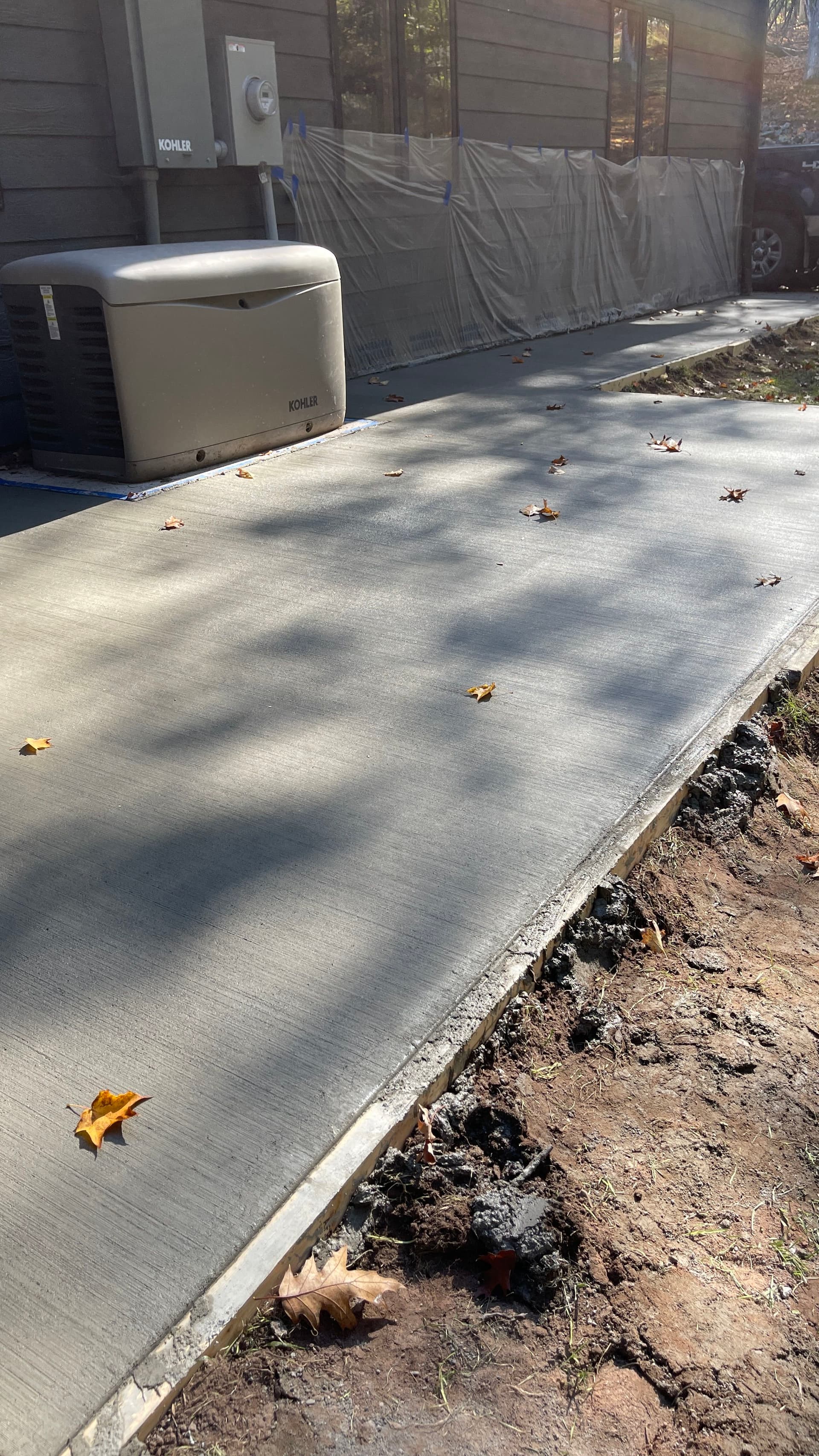 Concrete Patio and Sidewalk Pour Gives Homeowner a Clean Path