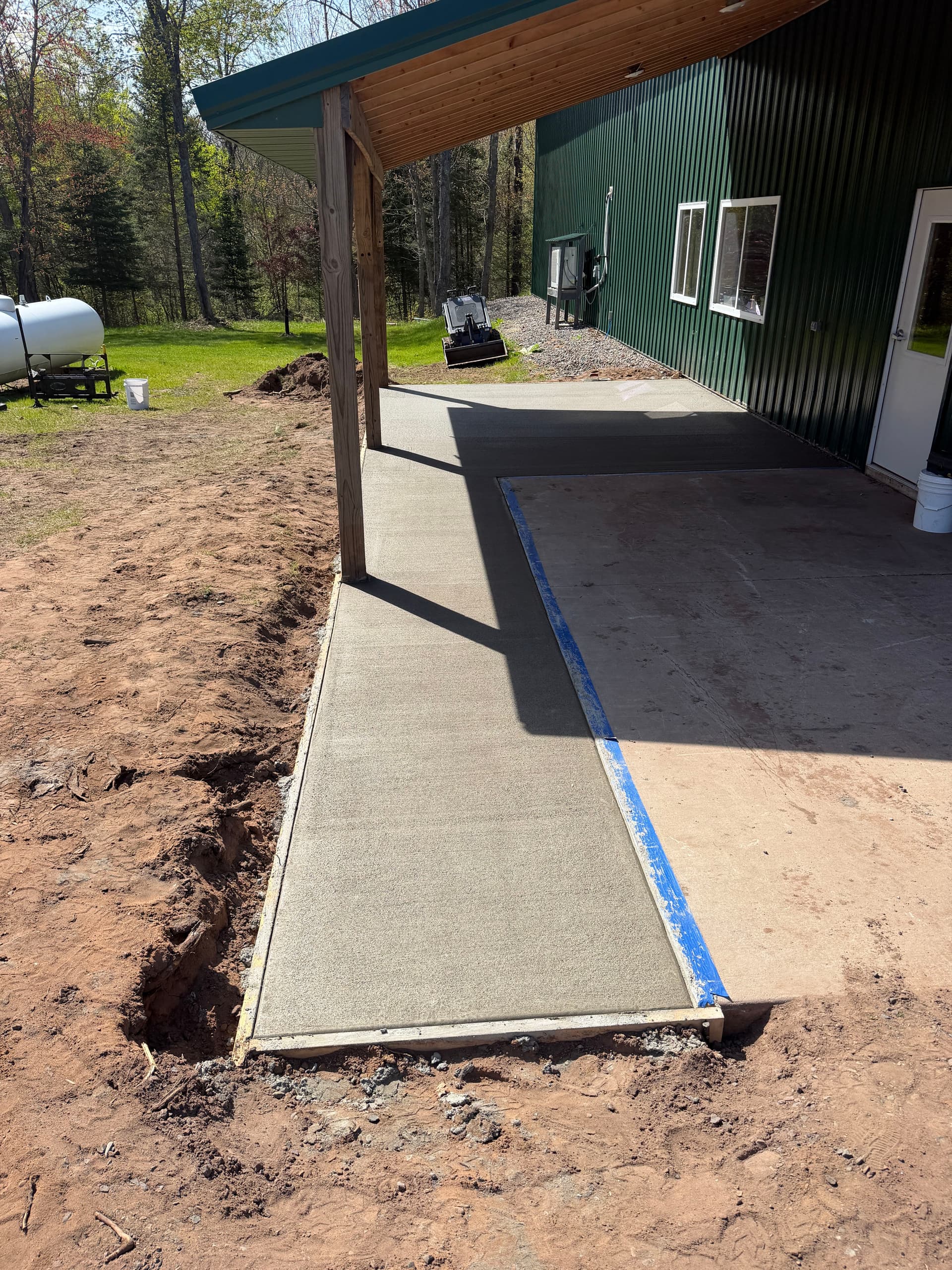 Lean-To Concrete Expansion Adds Real Working Room